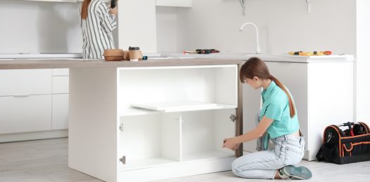 Young,Women,Assembling,Furniture,In,Kitchen