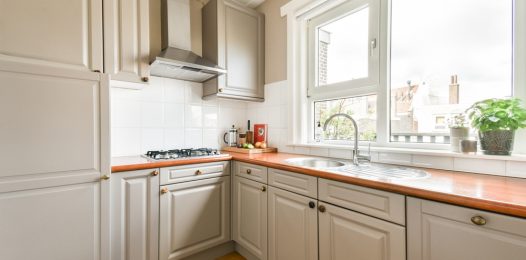 A,Sleek,,Modern,Kitchen,Showcasing,Minimalist,Cabinetry,,A,Stylish,Countertop,