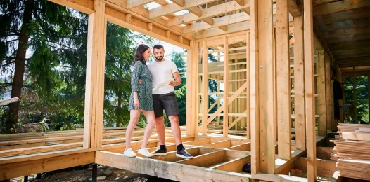 man-and-woman-inspecting-their-future-wooden-frame-2026-01-07-01-00-00-utc
