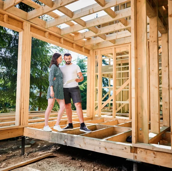 man-and-woman-inspecting-their-future-wooden-frame-2026-01-07-01-00-00-utc